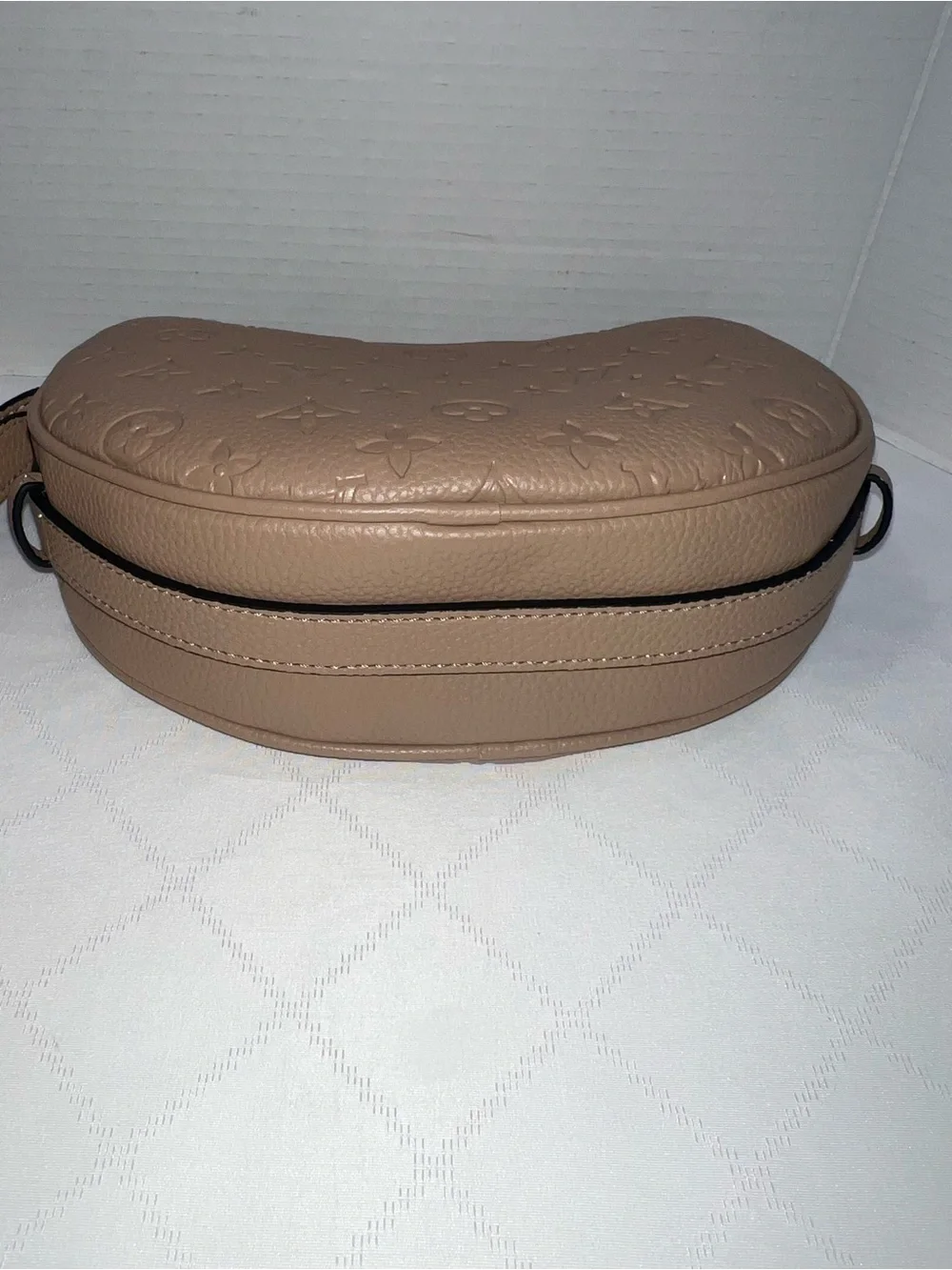 Designer inspired half-moon shoulder bag in a neutral taupe leather w/monogram